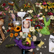 Flowers, candles and chalk-written messages surround a photograph of Heather Heyer on the spot where she was killed and 19 others injured when a car slammed into a crowd of people protesting a white supremacist rally Aug. 16, 2017, in Charlottesville, Va. (Chip Somodevilla/Getty Images)